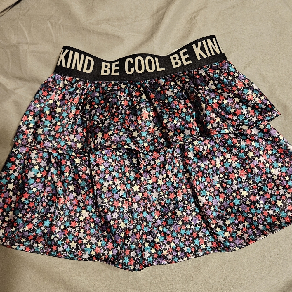 Rock star skirt with built-in in shorts size 6 matches lots of colors!